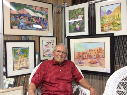 Roger Maller is July Artist of the Month. Roger is surrounded by his artwork in this picture. Photo courtesy of Julie Johnson. 